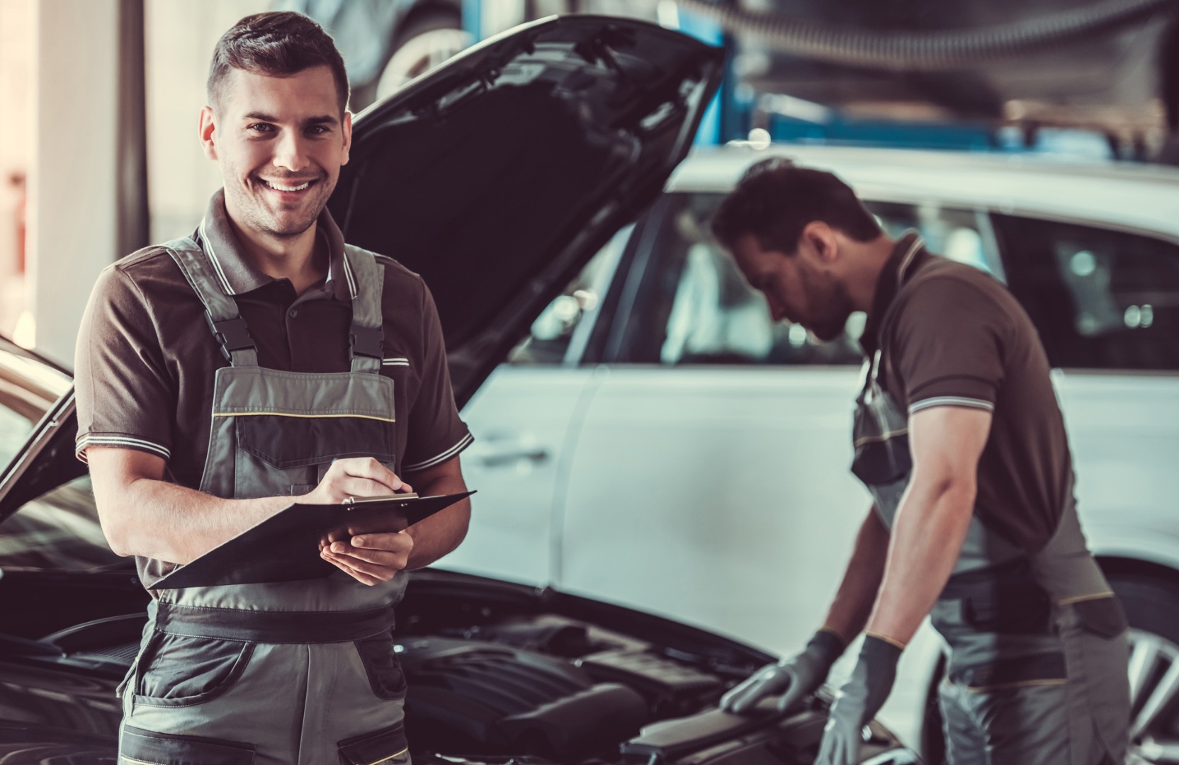Mechanics working on a vehicle - MOT and Servicing Parkgate, Rotherham
